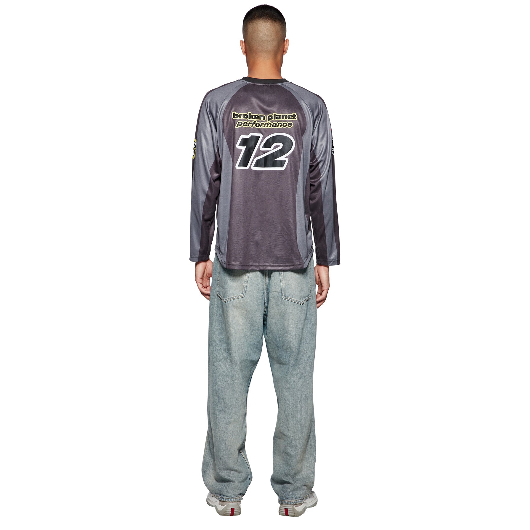Model back view of Broken Planet Football Black Grey Long Sleeve T Shirt